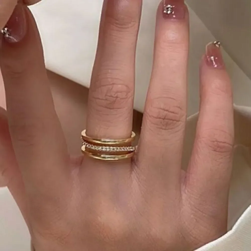 The Triple Bling Ring adjustable in 14k gold over 925 with cubic zirconia